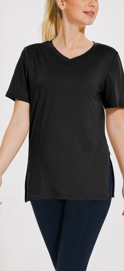 Woman wearing the black Selena loose-fit V-neck tee with side splits