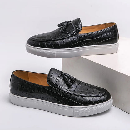 Vestralo Passero black tassel loafers, side profile view on white sole